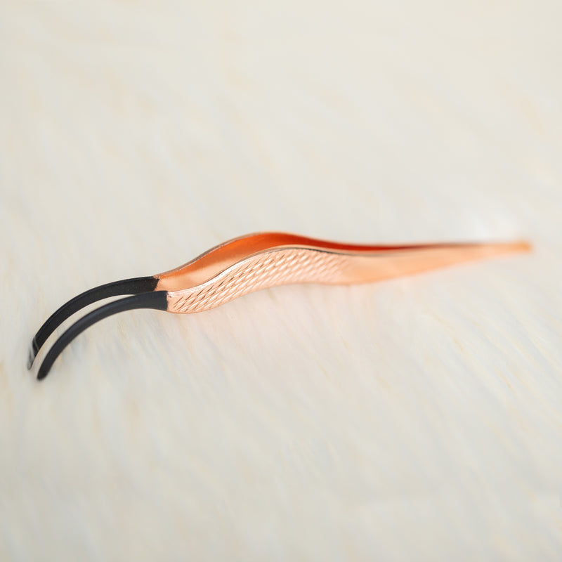 Curved rose gold tweezer